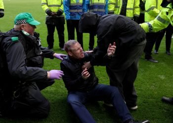 Pitch Invasion Mayhem: Coach Assaulted Amidst Fan Chaos
