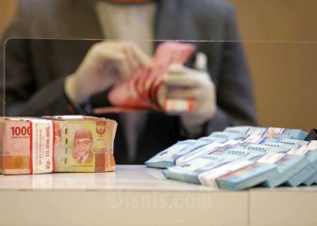 Upah Minimum RI: Ancaman Sektor Informal