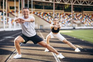woman-man-stretching-stadium-before-jogging.jpg