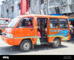 ambon-indonesia-february-2018-angkot-public-transport-vehicles-in-urban-traffic-that-is-colorful-buses-on-ambon-island-each-color-goes-to-a-diff-2GFEXH0.jpg